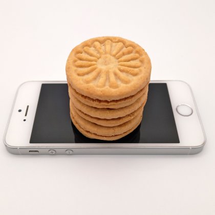 A pile of cookies on top of a phone.