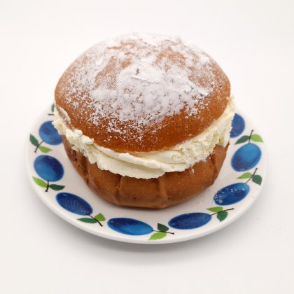 A Semla or Cream Bun on a saucer
